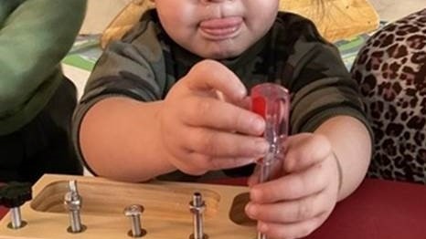 Child playing with tools